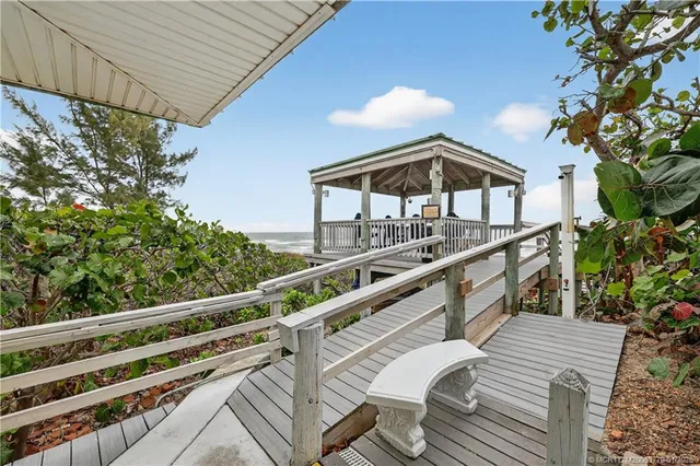 a view of a house with a yard and a garden