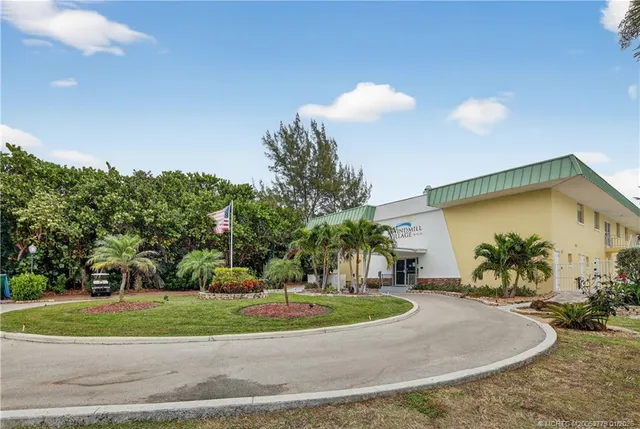 an aerial view of a house with a lake view