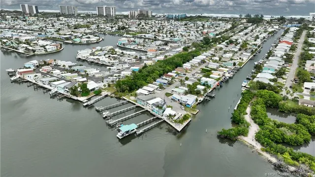 an aerial view of a house with a lake view