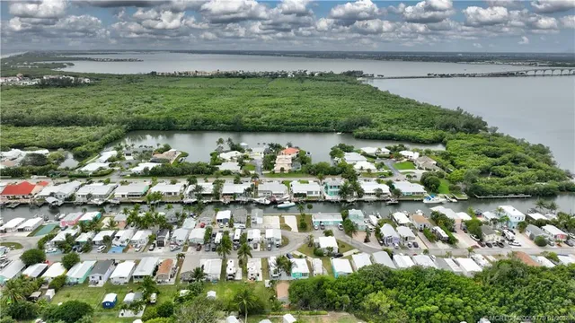 an aerial view of a residential houses with outdoor space