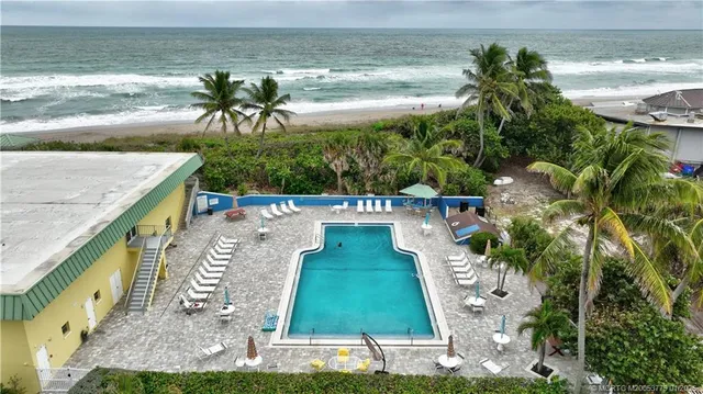 a view of a swimming pool with a patio