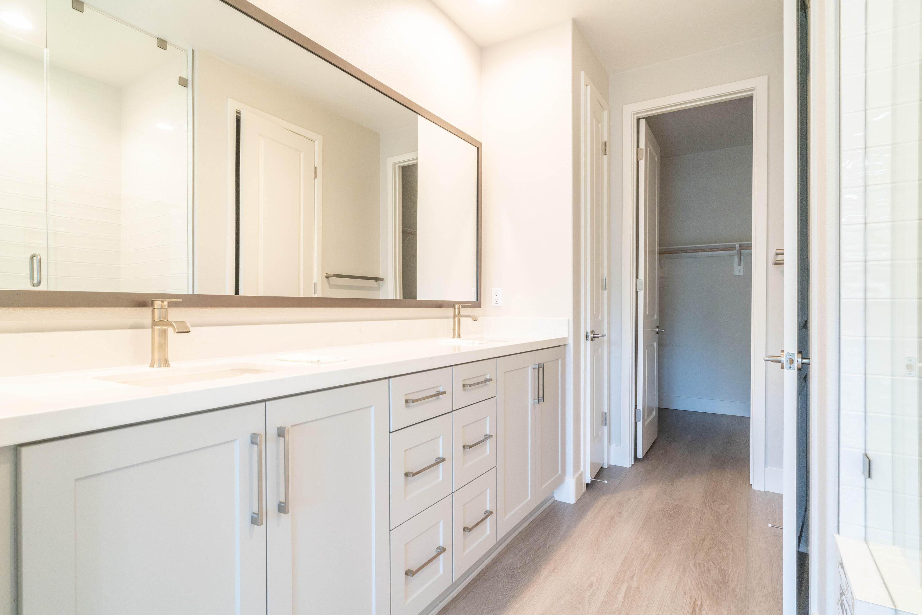 51580 Whiptail Drive Indio, CA 92201 - Photo 14 of 28 a bathroom with a double vanity sink and a mirror