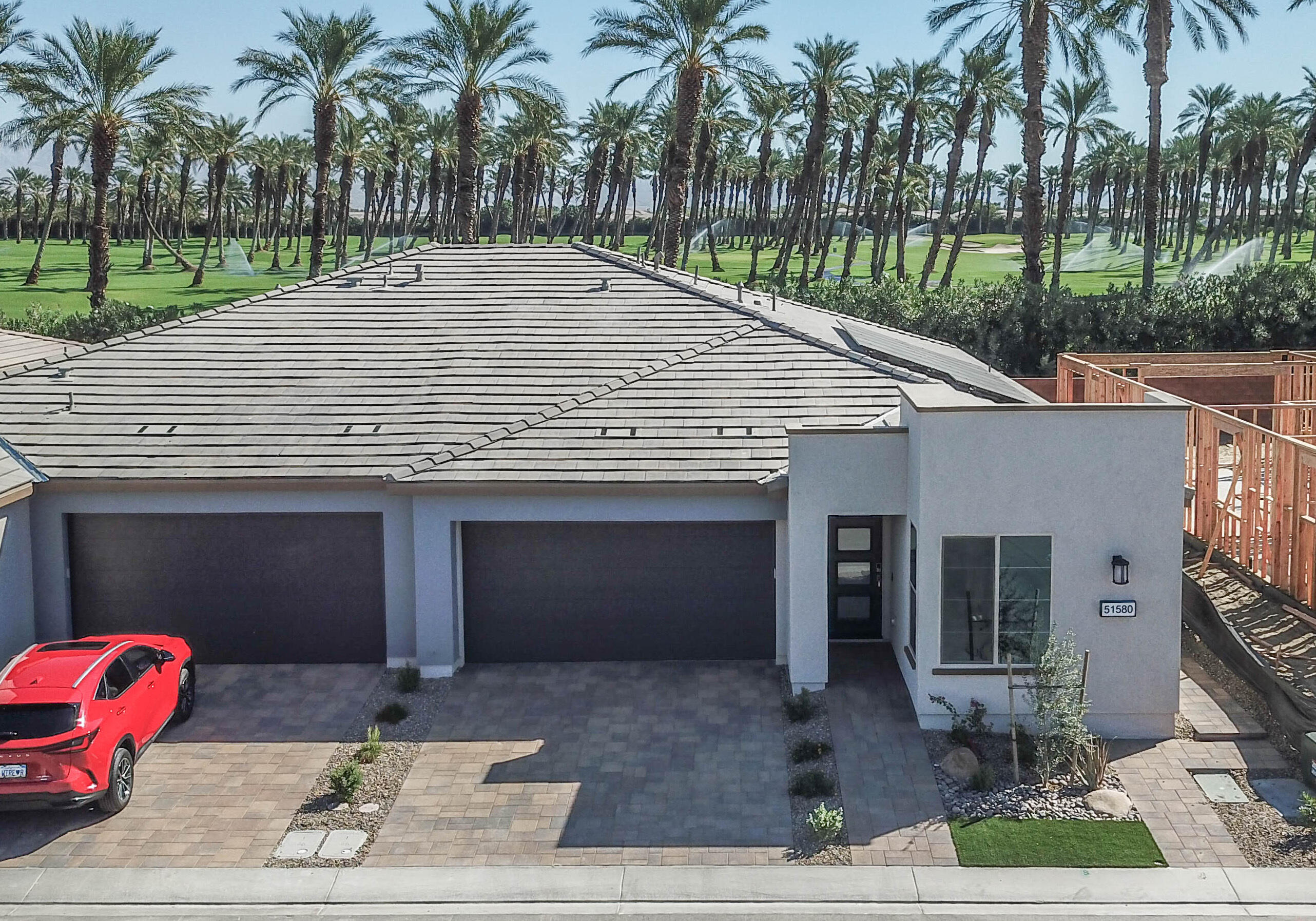 51580 Whiptail Drive Indio, CA 92201 - Photo 27 of 28 a house with palm tree in front of it