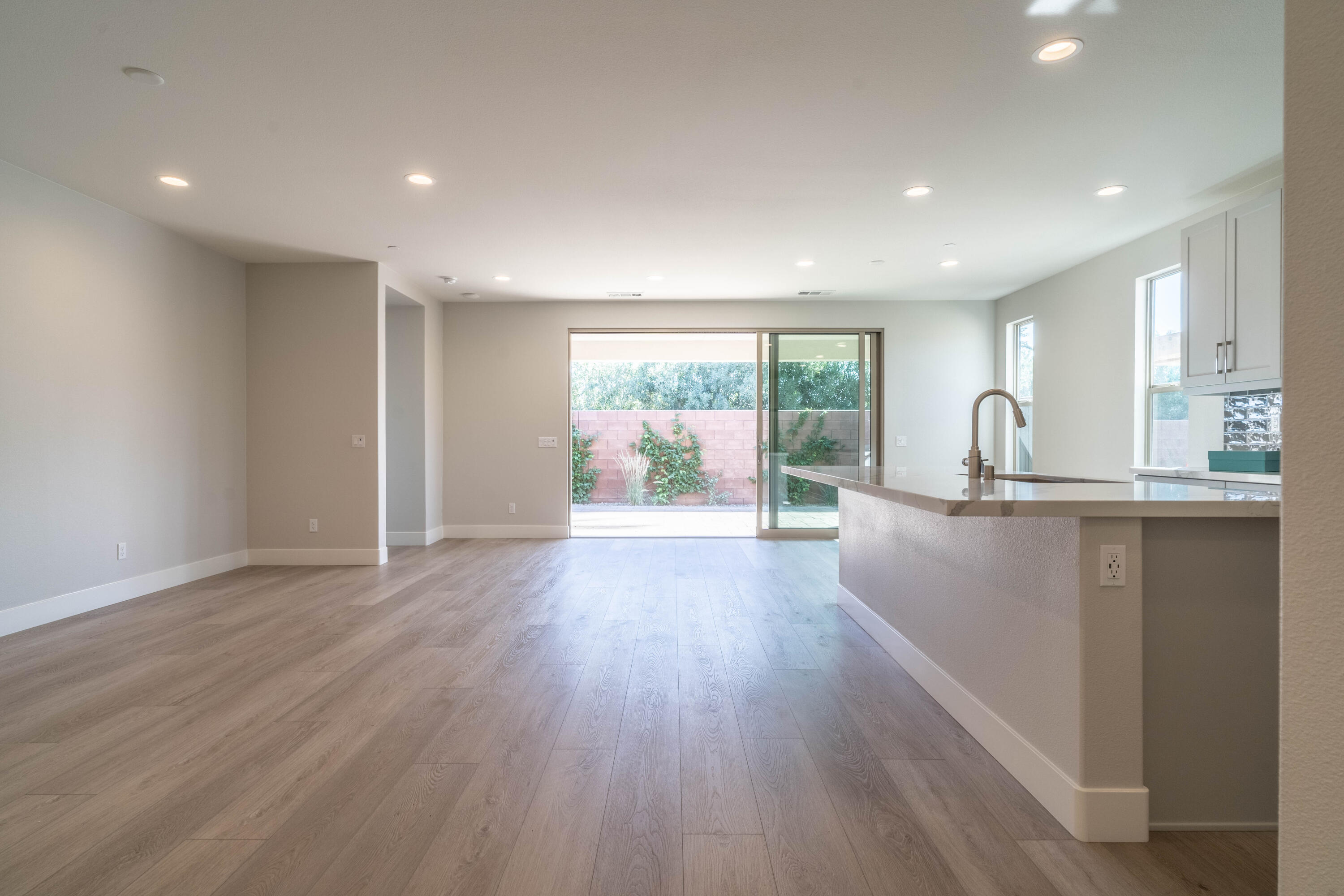 51580 Whiptail Drive Indio, CA 92201 - Photo 3 of 28 a view of a kitchen with wooden floor and outdoor space