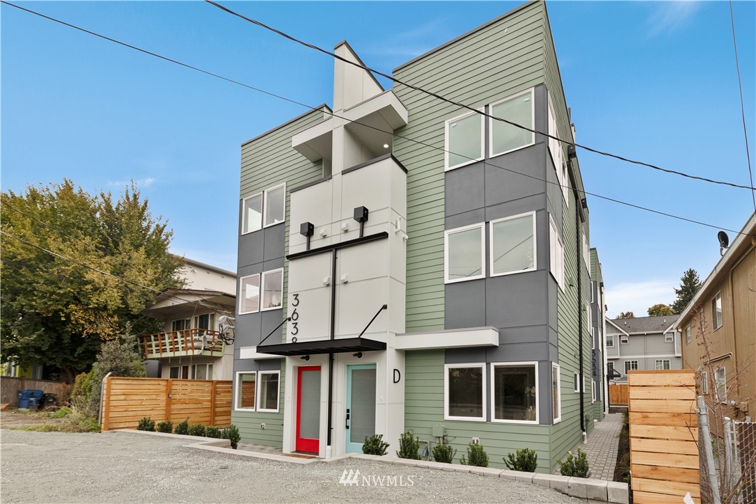 a front view of a residential apartment building with a yard