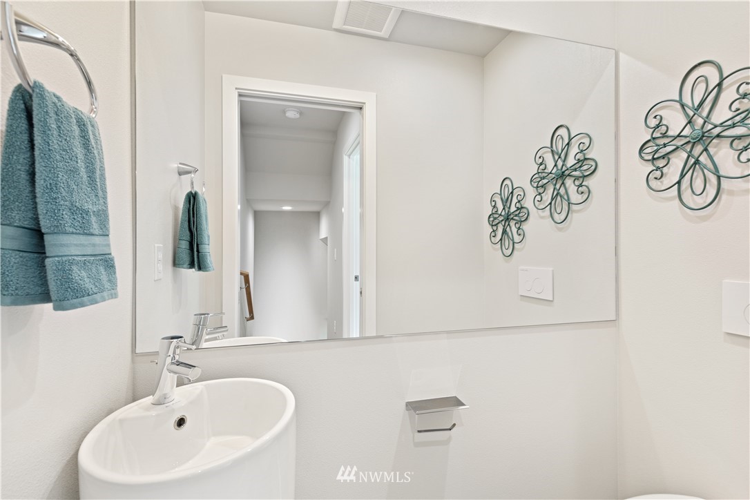 3638 36th Avenue South, Unit D Seattle, WA 98144 - Photo 12 of 30 a bathroom with a sink and a mirror