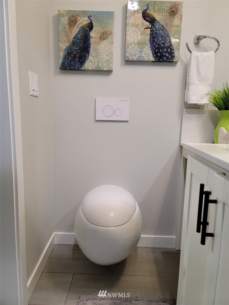 3638 36th Avenue South, Unit D Seattle, WA 98144 - Photo 13 of 30 a bathroom with a toilet and a sink