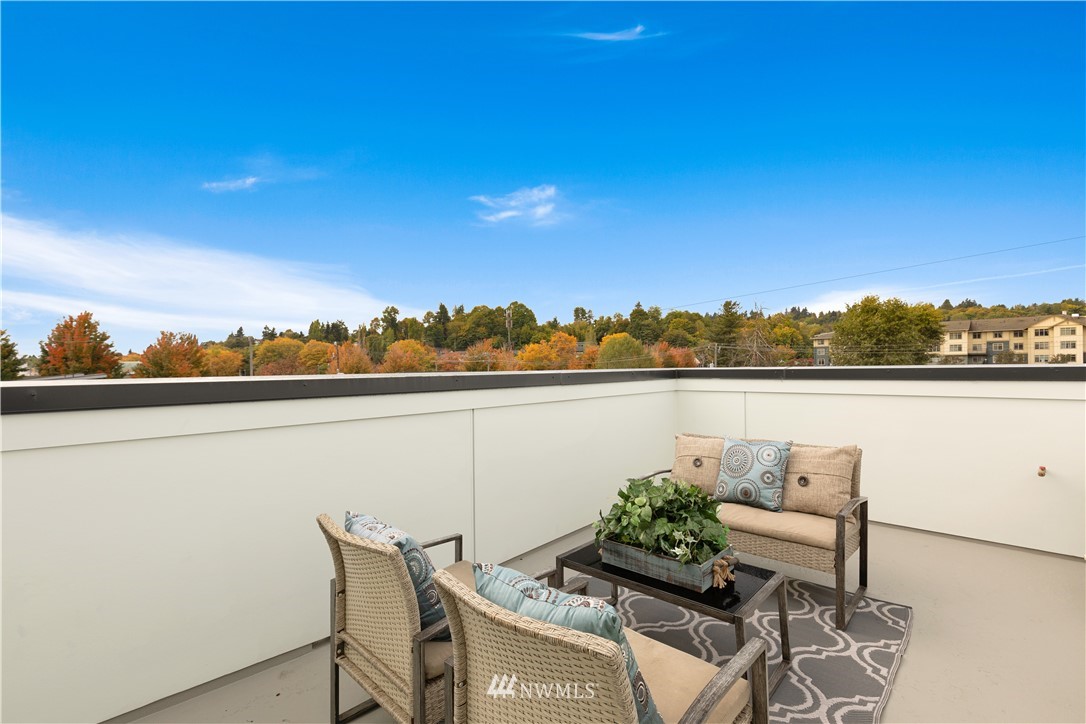 3638 36th Avenue South, Unit D Seattle, WA 98144 - Photo 15 of 30 a terrace with a table and chairs