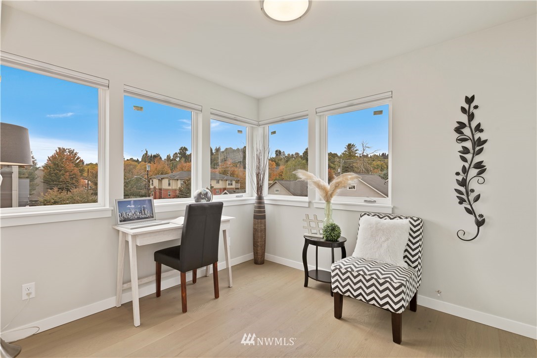 3638 36th Avenue South, Unit D Seattle, WA 98144 - Photo 5 of 30 a living room with furniture and a window