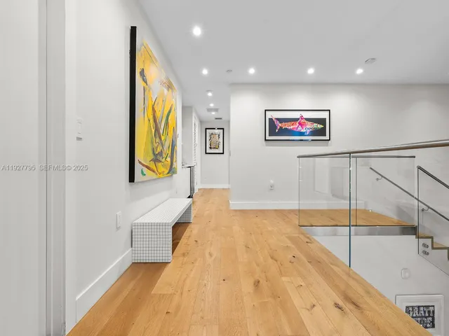 a spacious bathroom with a large mirror