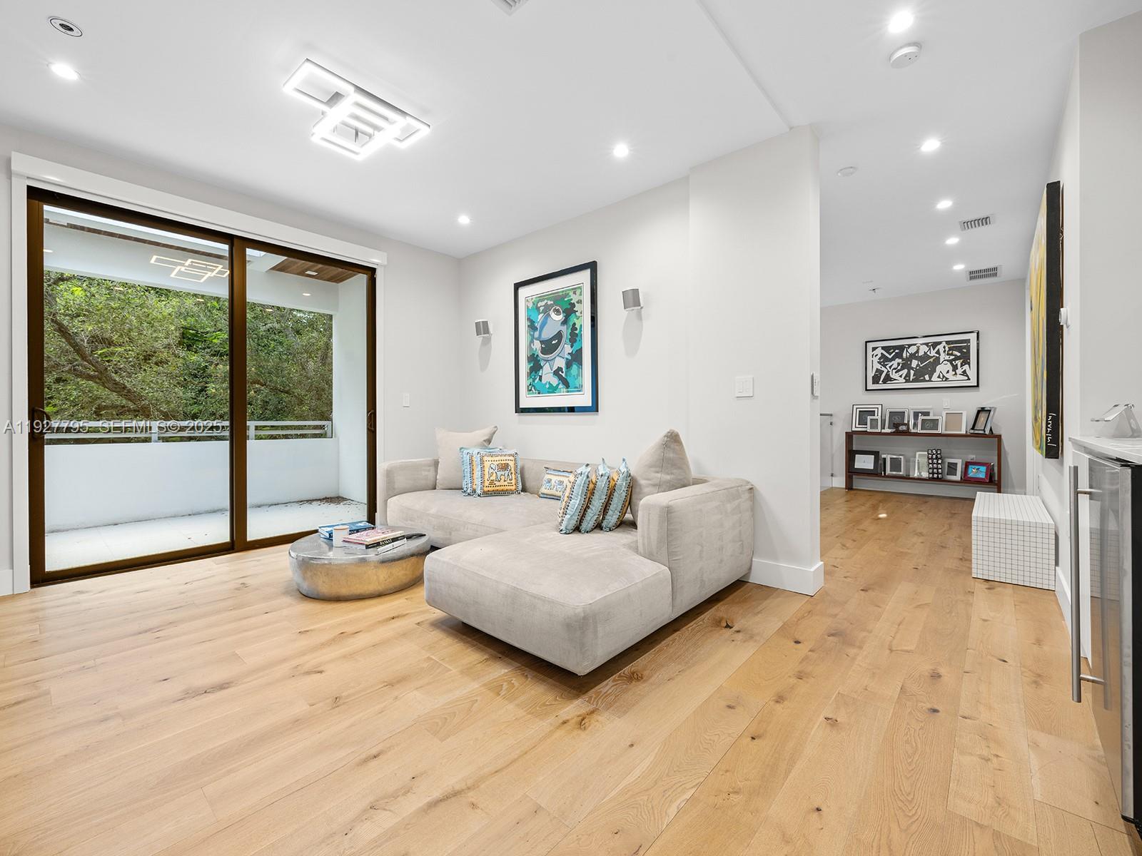 1760 Chucunantah Road Miami, FL 33133 - Photo 15 of 21 a spacious bedroom with a large bed and a couch