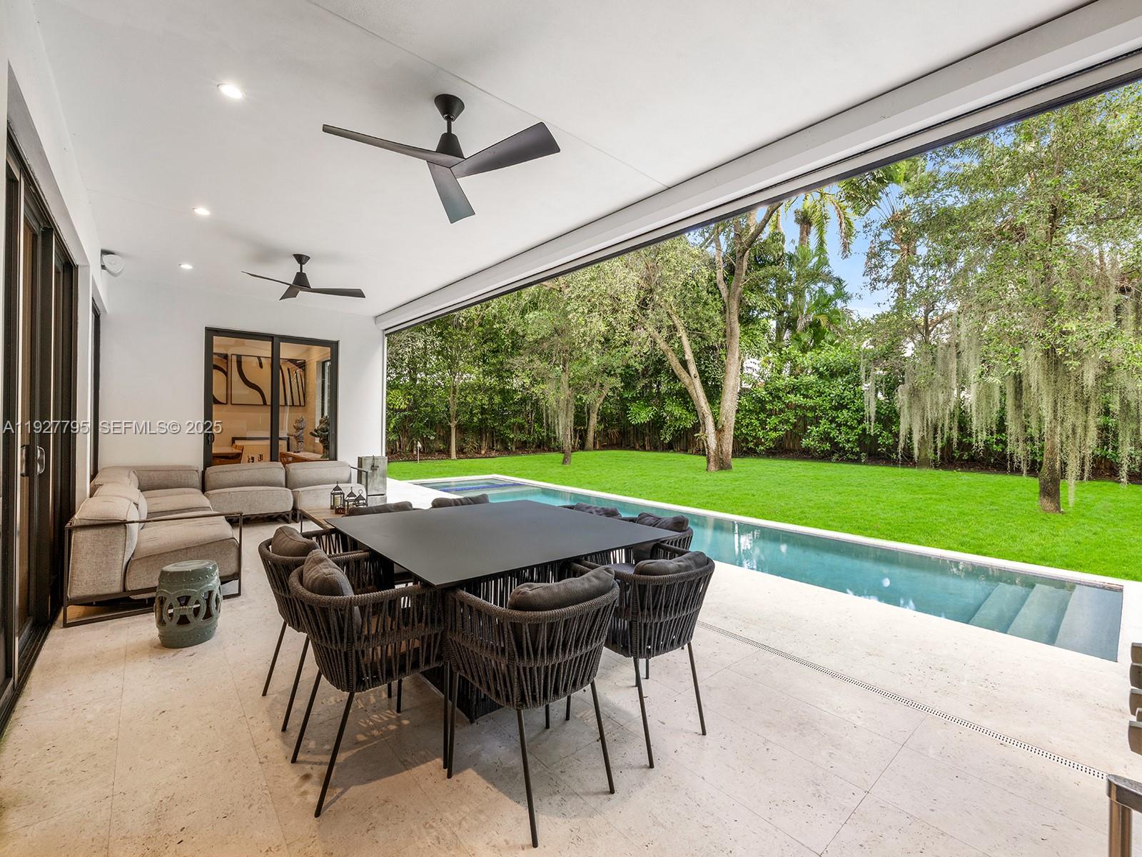 1760 Chucunantah Road Miami, FL 33133 - Photo 16 of 21 a table and chairs in front of a building