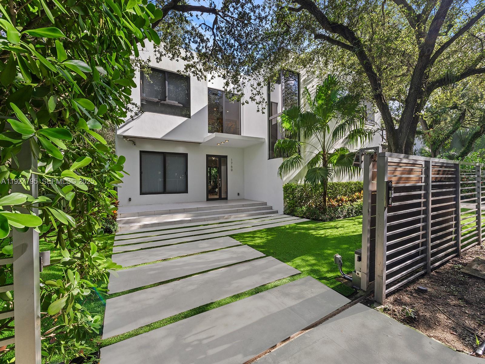 1760 Chucunantah Road Miami, FL 33133 - Photo 18 of 21 a front view of a house with garden