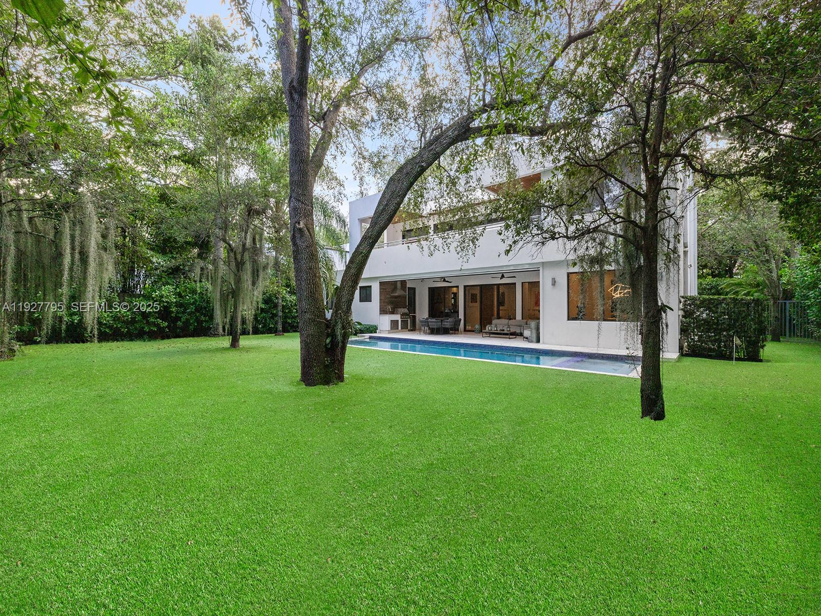 1760 Chucunantah Road Miami, FL 33133 - Photo 20 of 21 a front view of house with yard and green space
