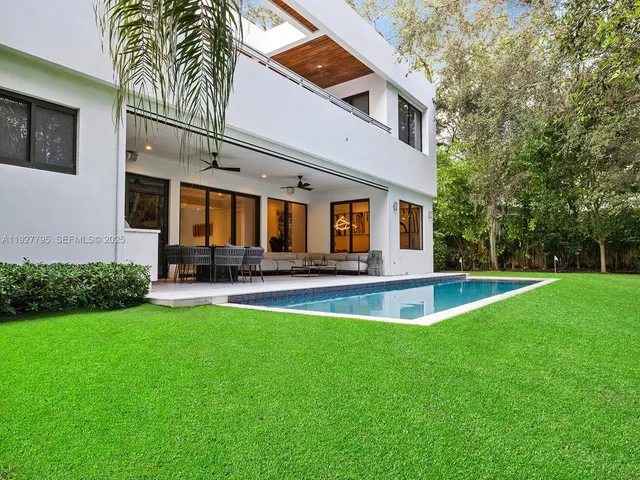 a view of a house with swimming pool yard and porch