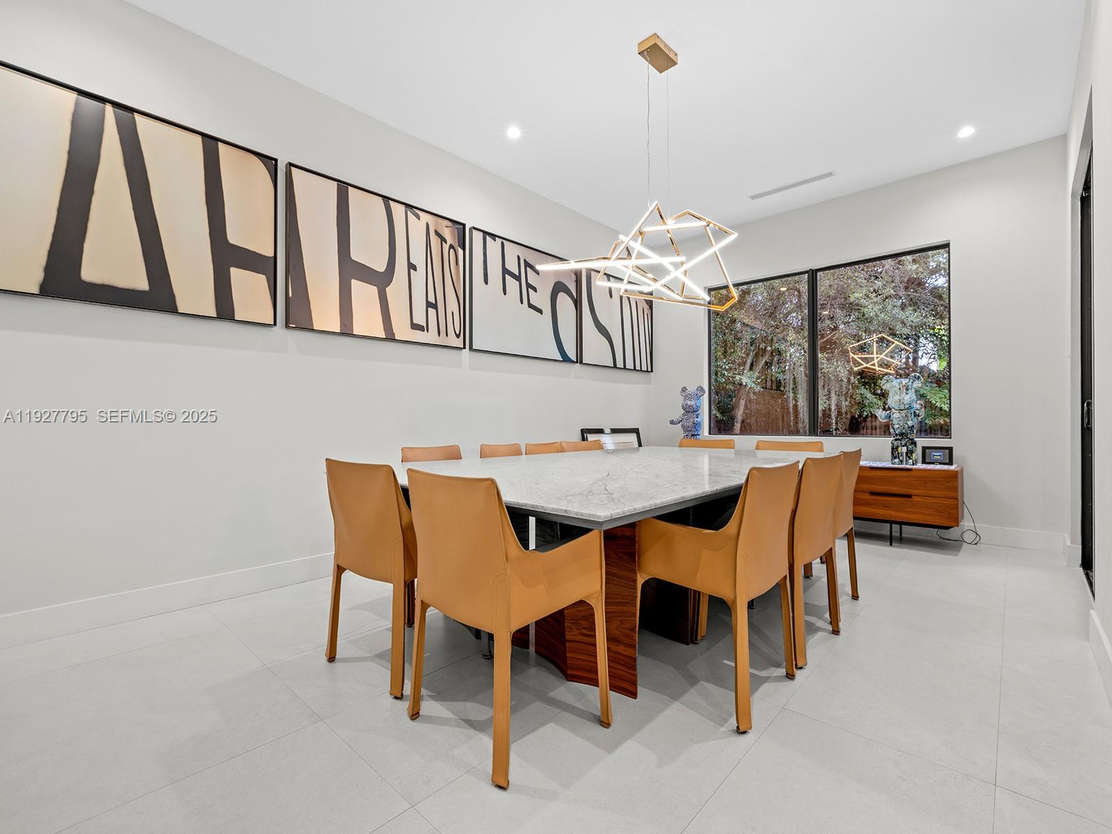 1760 Chucunantah Road Miami, FL 33133 - Photo 4 of 21 a view of a dining room with furniture window and outside view