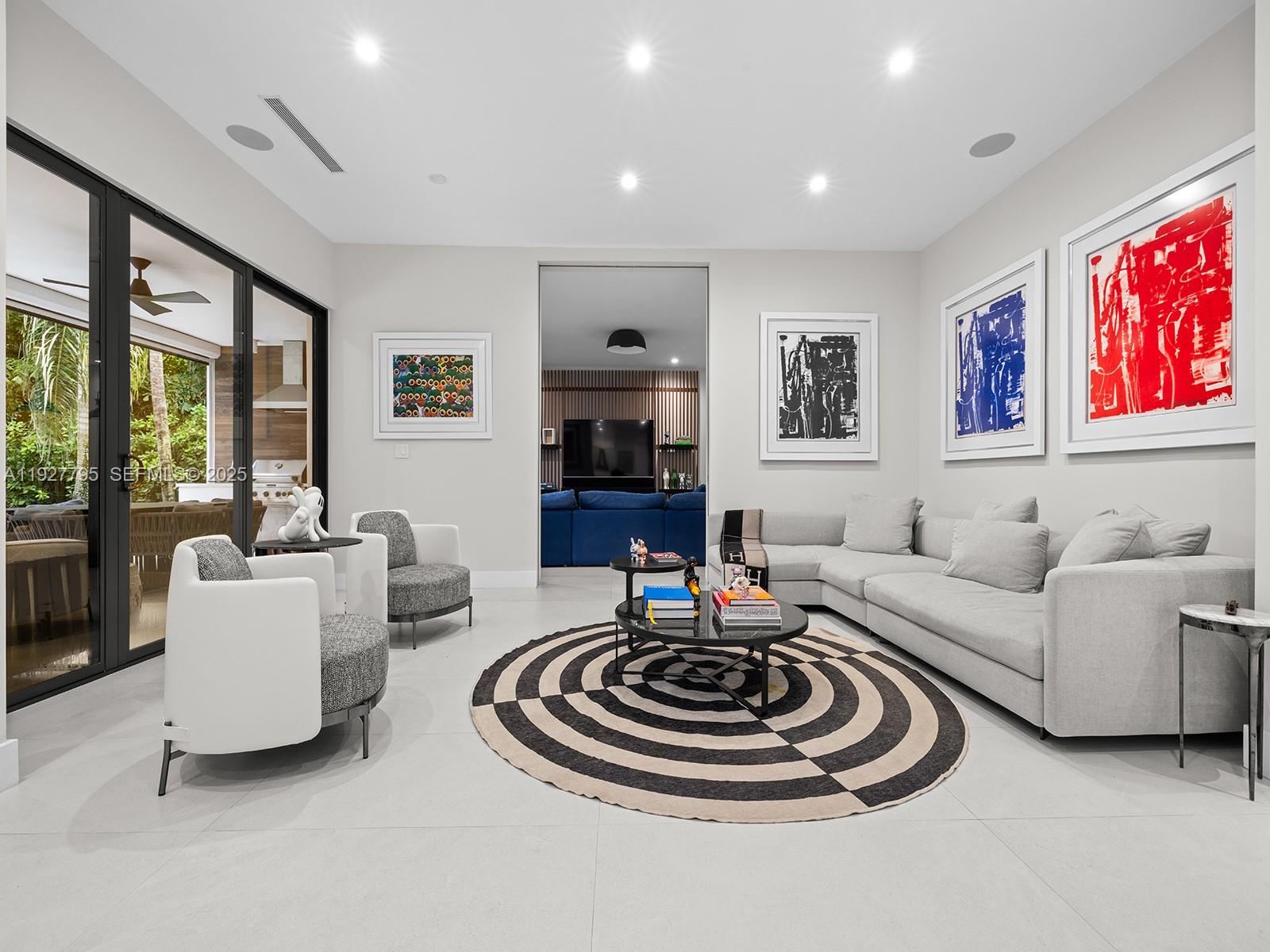 1760 Chucunantah Road Miami, FL 33133 - Photo 7 of 21 a living room with furniture and a fireplace