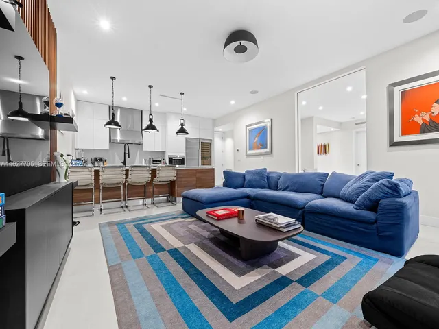 a living room with furniture and a rug
