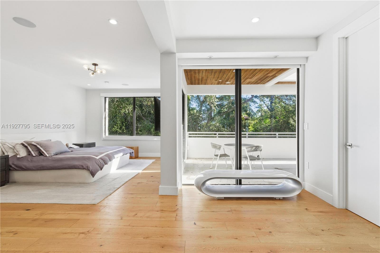 1760 Chucunantah Road Miami, FL 33133 - Photo 10 of 21 a living room with furniture and a large window