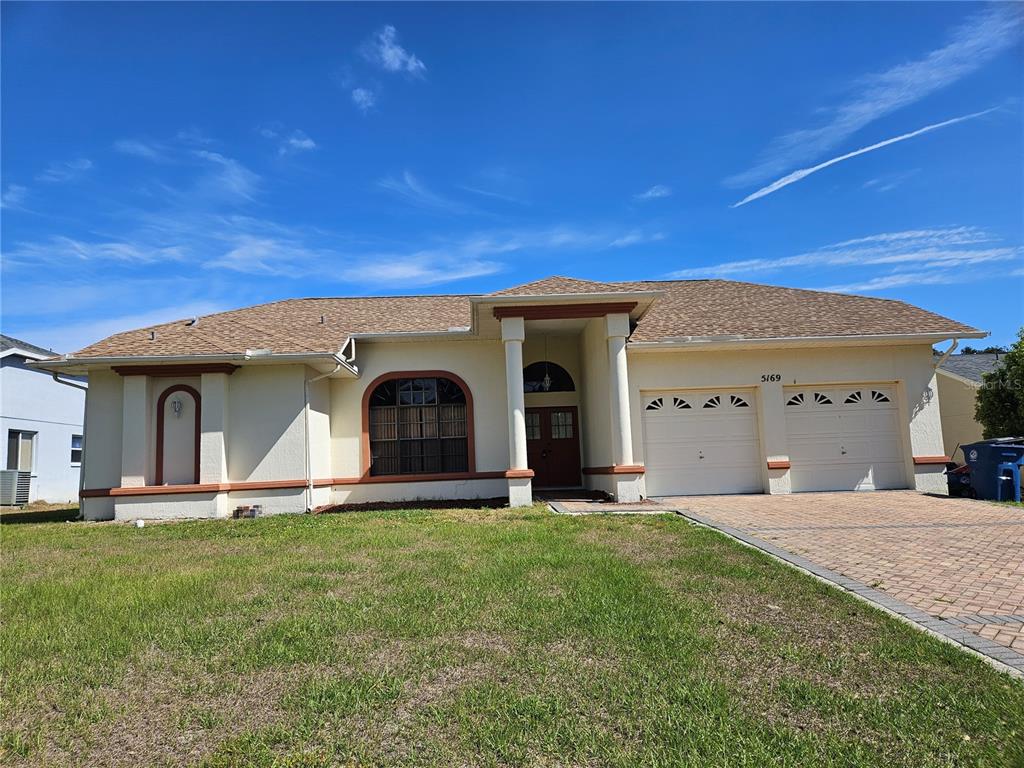 a view of a house with a yard