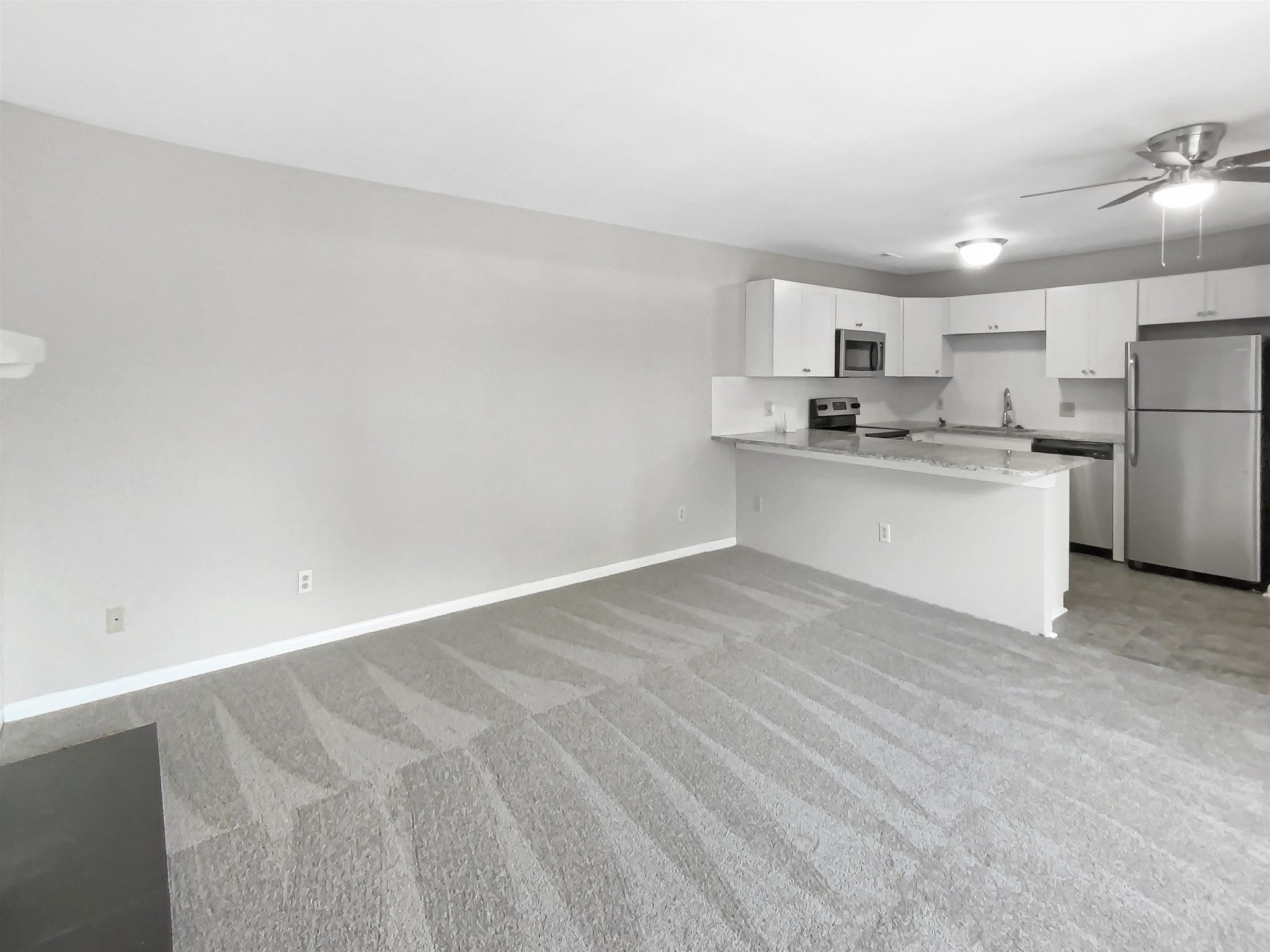 294 Summerwalk Circle Chapel Hill, NC 27517 - Photo 12 of 21 a kitchen with stainless steel appliances a refrigerator and a sink