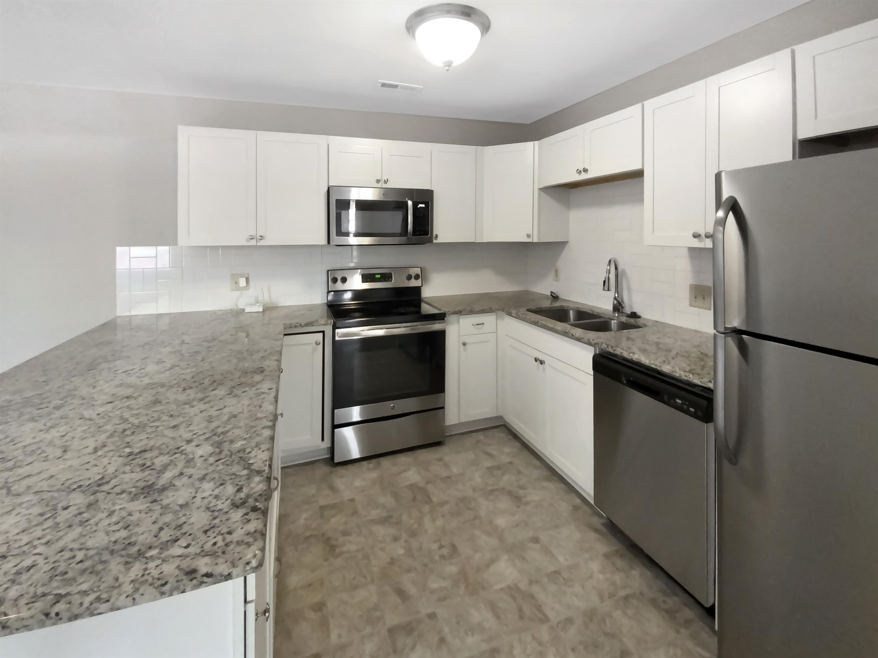 294 Summerwalk Circle Chapel Hill, NC 27517 - Photo 15 of 21 a kitchen with stainless steel appliances granite countertop a stove a sink and a refrigerator