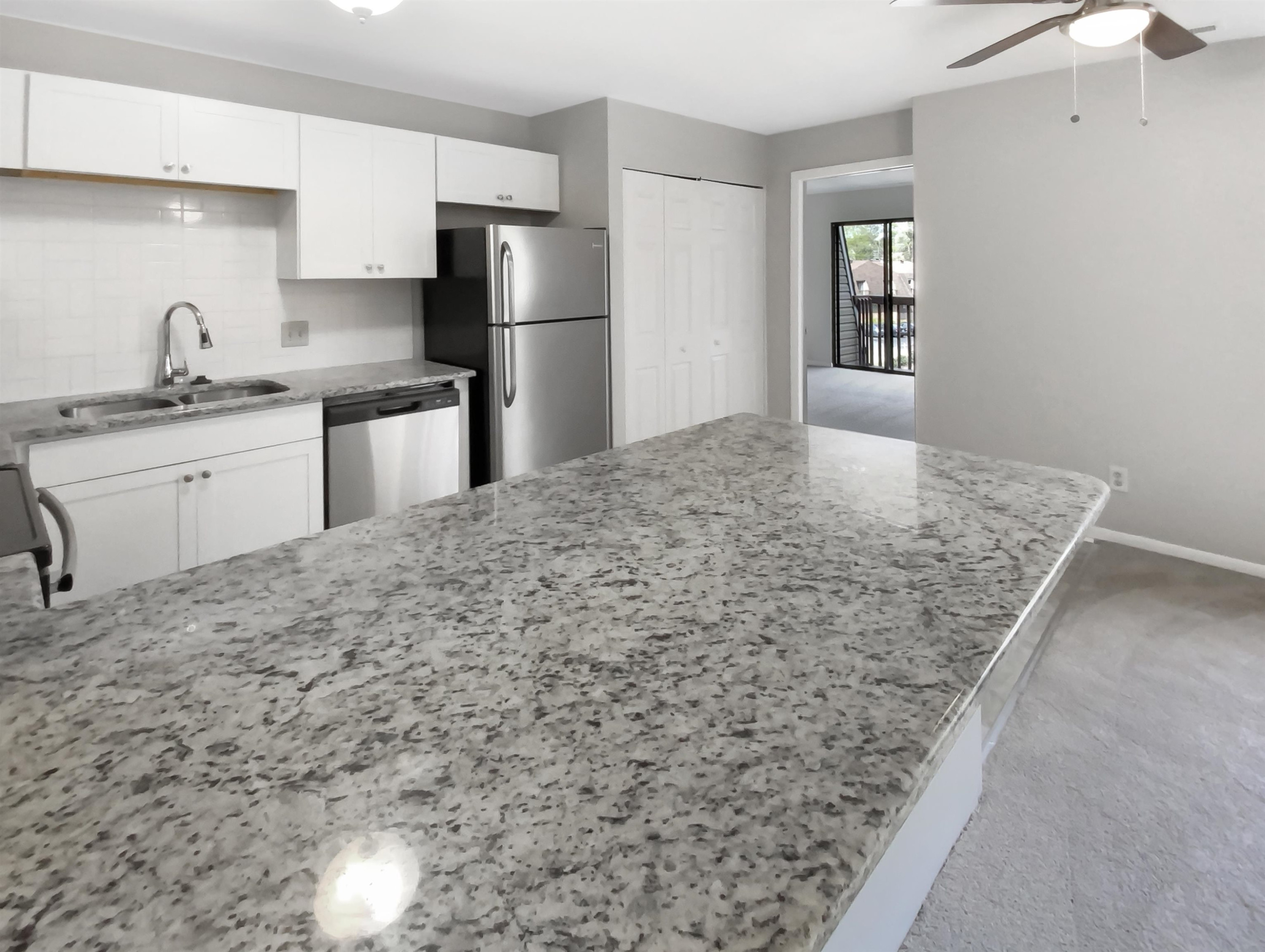 294 Summerwalk Circle Chapel Hill, NC 27517 - Photo 16 of 21 a kitchen with stainless steel appliances granite countertop a sink stove and refrigerator
