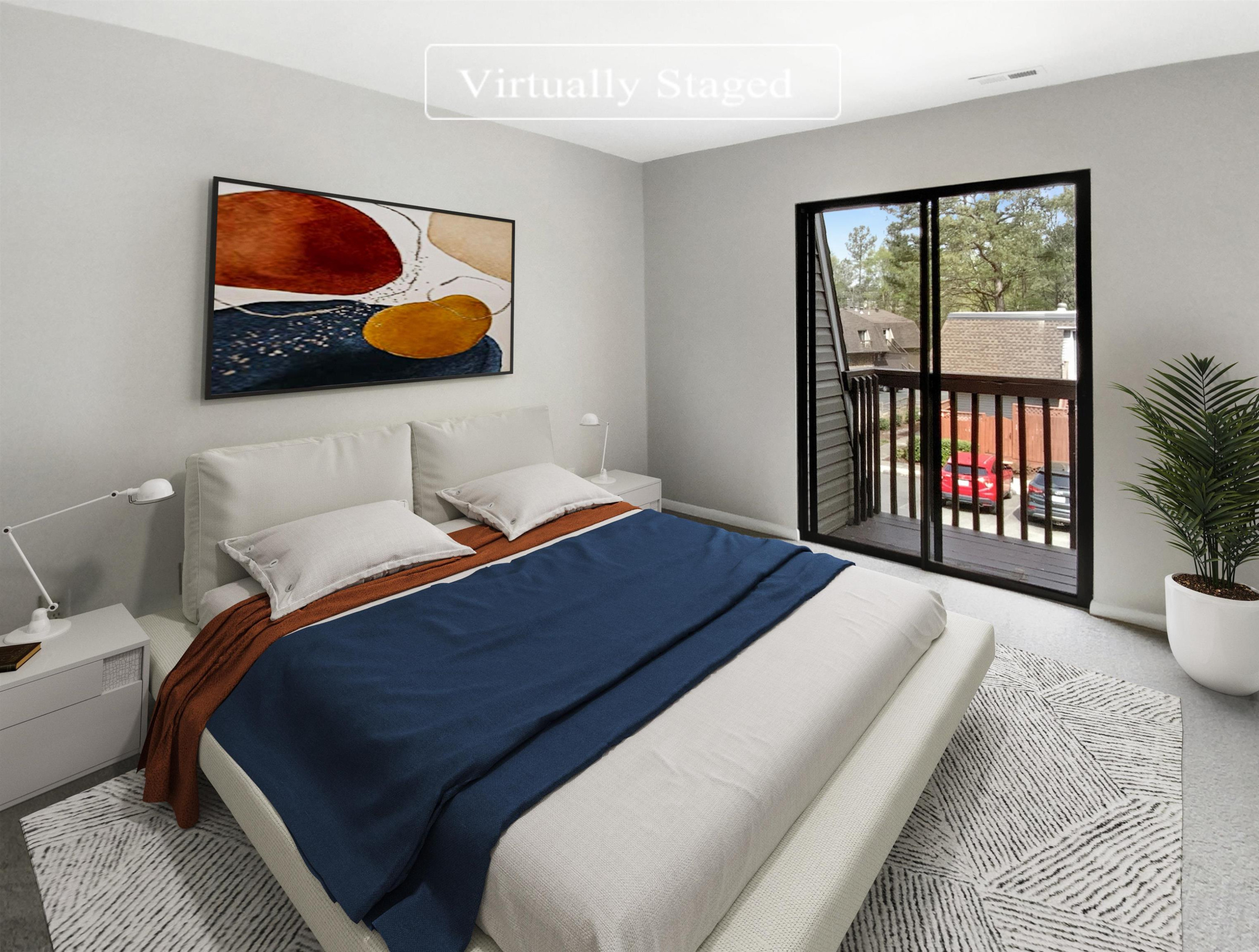 294 Summerwalk Circle Chapel Hill, NC 27517 - Photo 4 of 21 a bedroom with a large bed and a painting on the wall