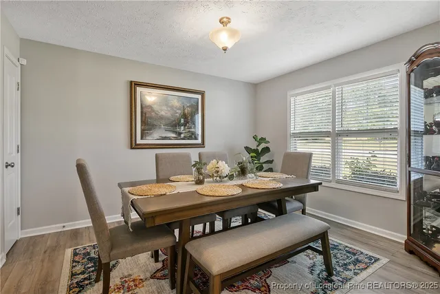 a view of a dining room with furniture