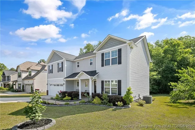 a front view of a house with garden