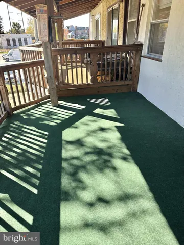 a view of a porch with a yard