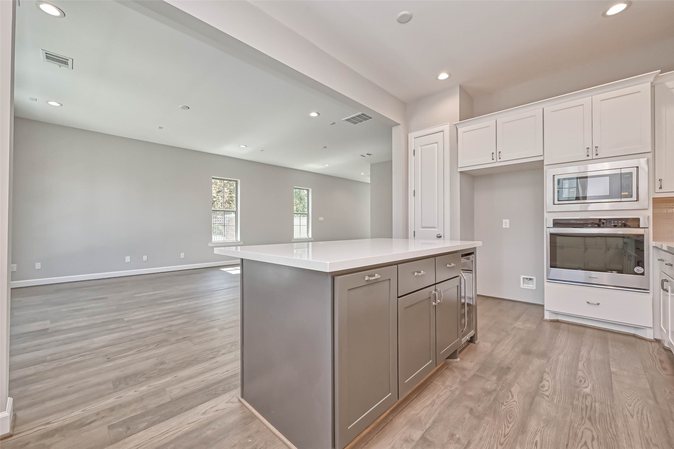 1908 Carrollton Mill Drive Spring, TX 77380 - Photo 12 of 40 a kitchen with granite countertop white cabinets and white appliances