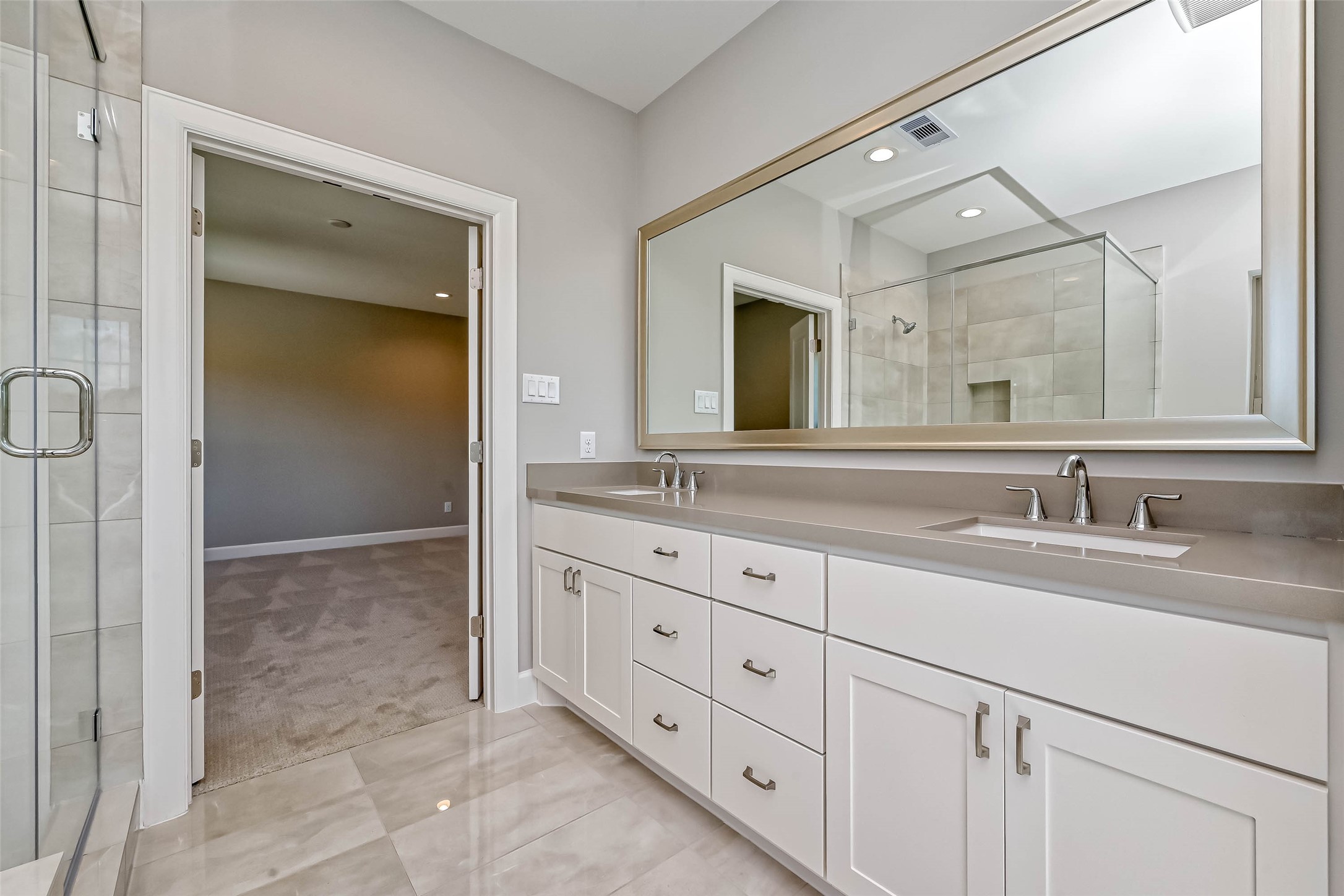 1908 Carrollton Mill Drive Spring, TX 77380 - Photo 28 of 40 a bathroom with double sink and a mirror