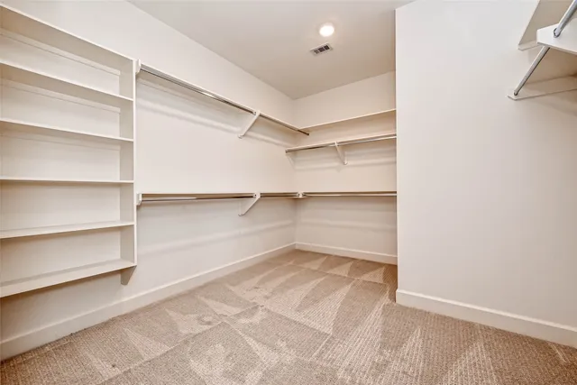 a view of a room with shelf on the wall