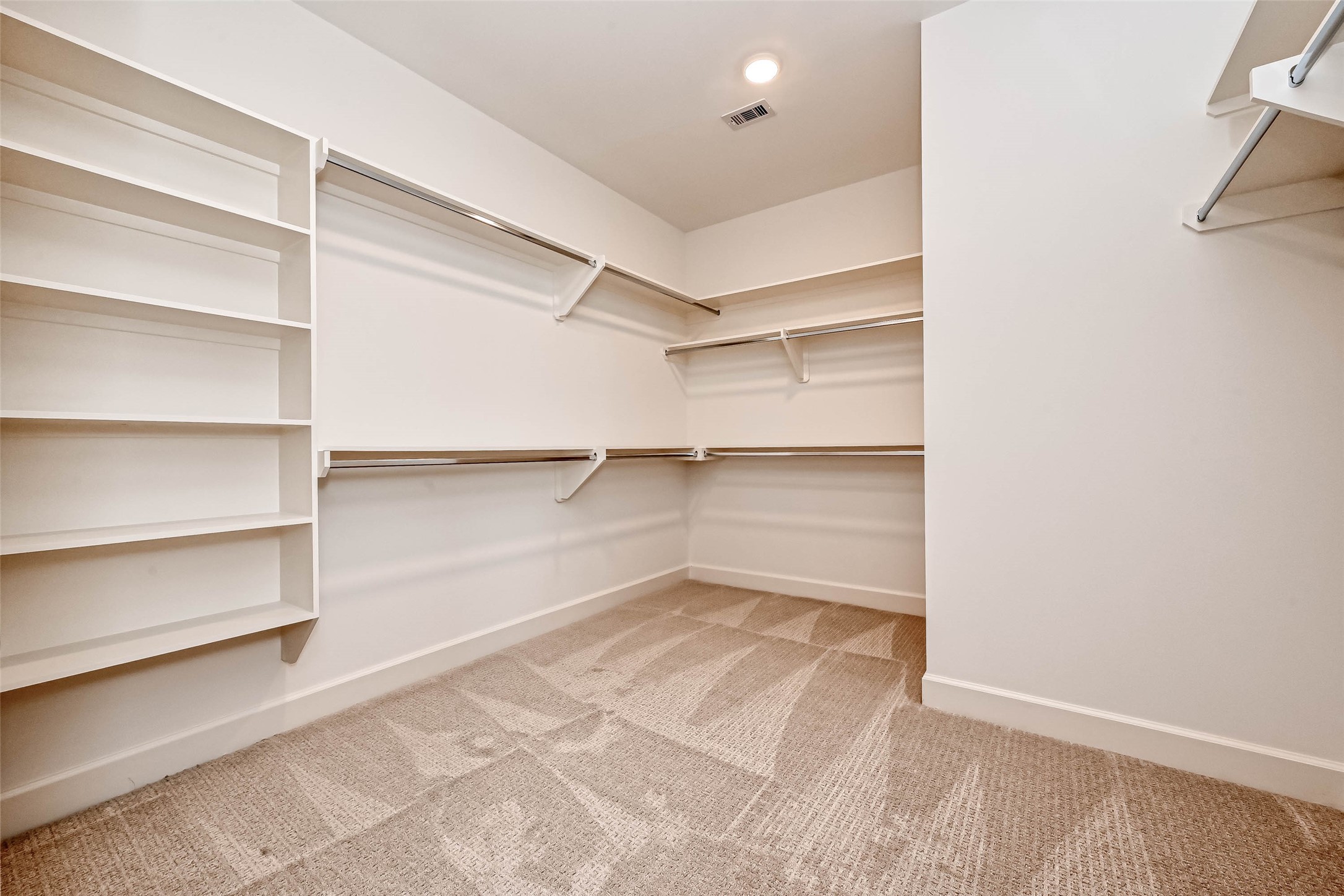 1908 Carrollton Mill Drive Spring, TX 77380 - Photo 31 of 40 a view of a room with shelf on the wall