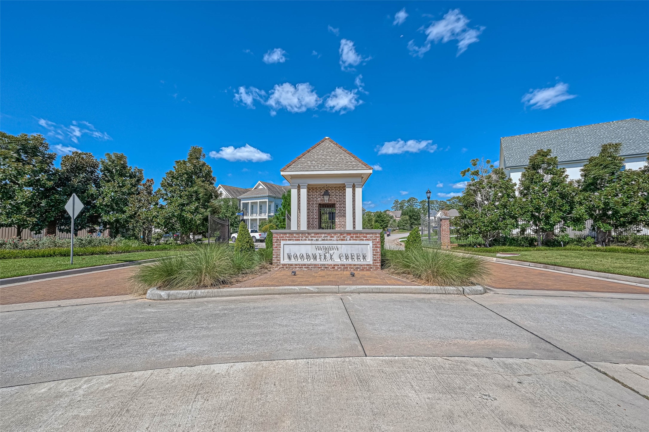 1908 Carrollton Mill Drive Spring, TX 77380 - Photo 33 of 40 a front view of a house with a yard and potted plants