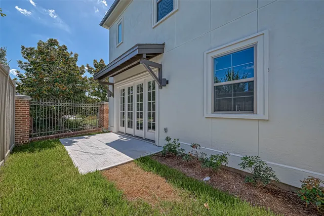 a view of backyard with a garden and plants