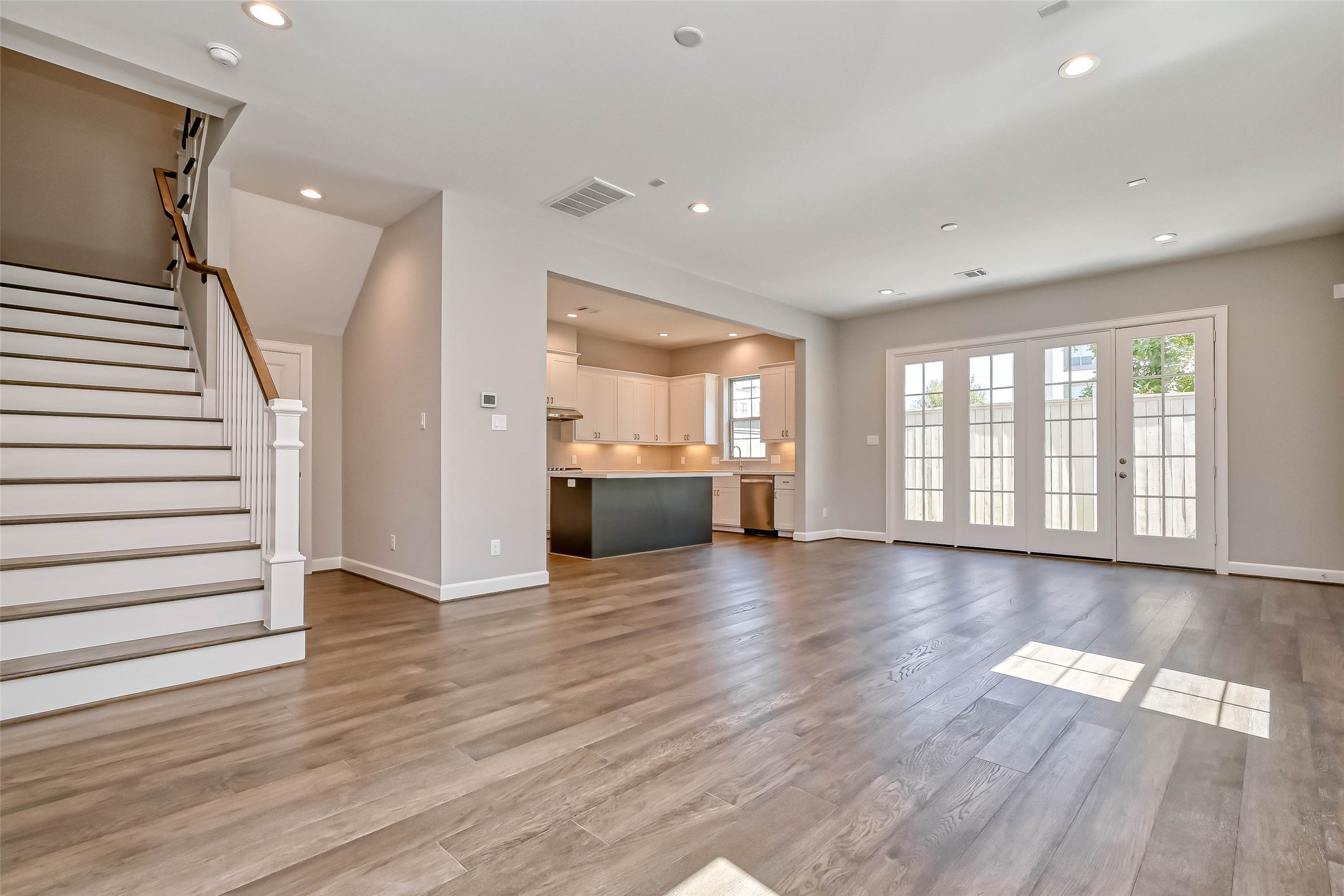 1908 Carrollton Mill Drive Spring, TX 77380 - Photo 5 of 40 a view of an empty room with wooden floor and a window