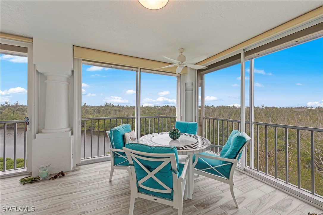 2605 Wulfert Road, Unit 5 Sanibel, FL 33957 - Photo 1 of 44 a view of a city from a dining room with lounge chair