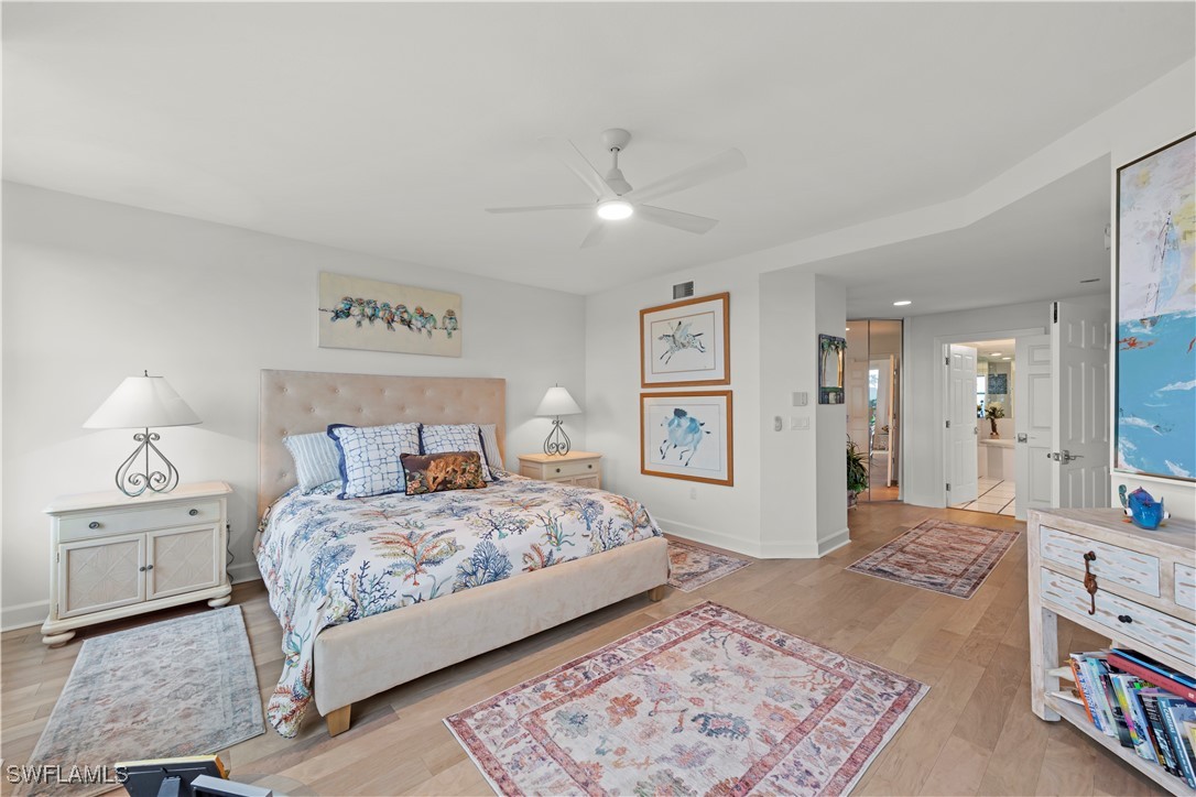 2605 Wulfert Road, Unit 5 Sanibel, FL 33957 - Photo 19 of 44 a bedroom with a large bed and a rug