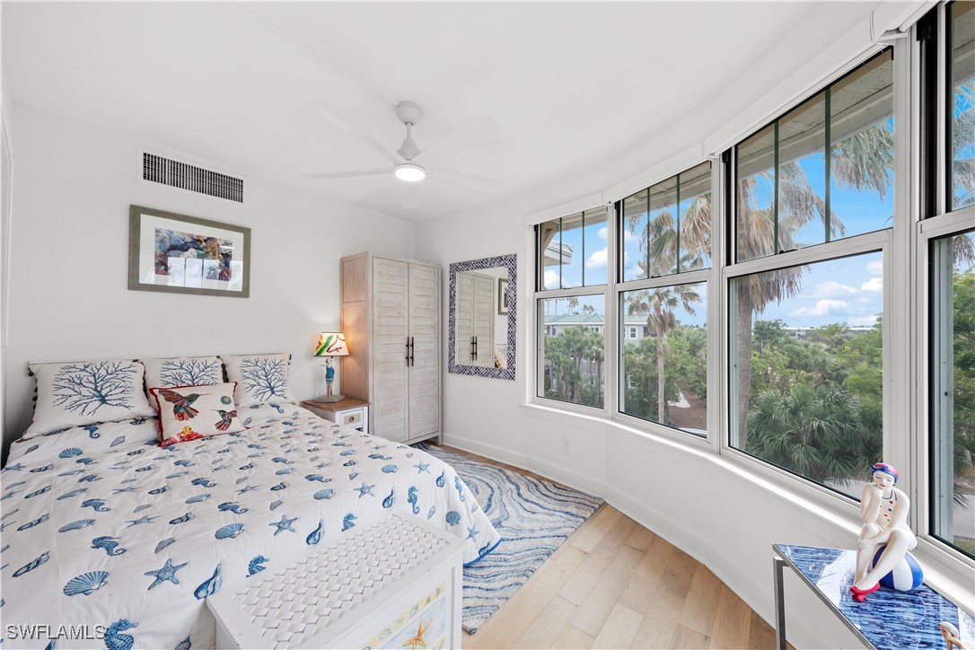 2605 Wulfert Road, Unit 5 Sanibel, FL 33957 - Photo 26 of 44 a bedroom with a large bed and a window