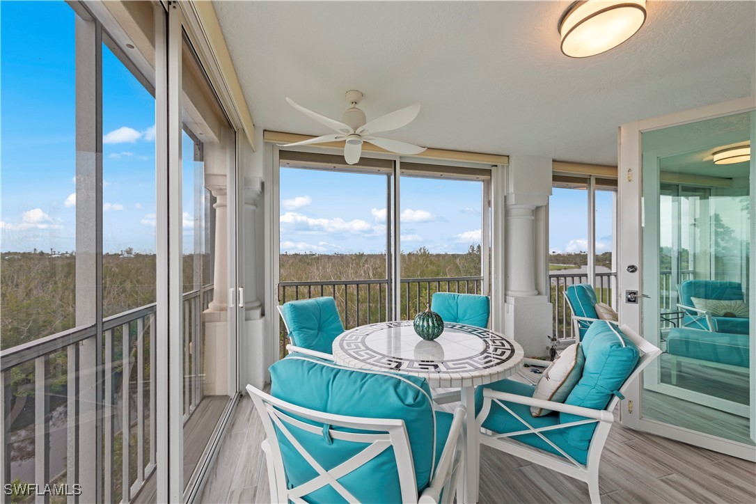 2605 Wulfert Road, Unit 5 Sanibel, FL 33957 - Photo 32 of 44 a view of a city from a dining room with large windows