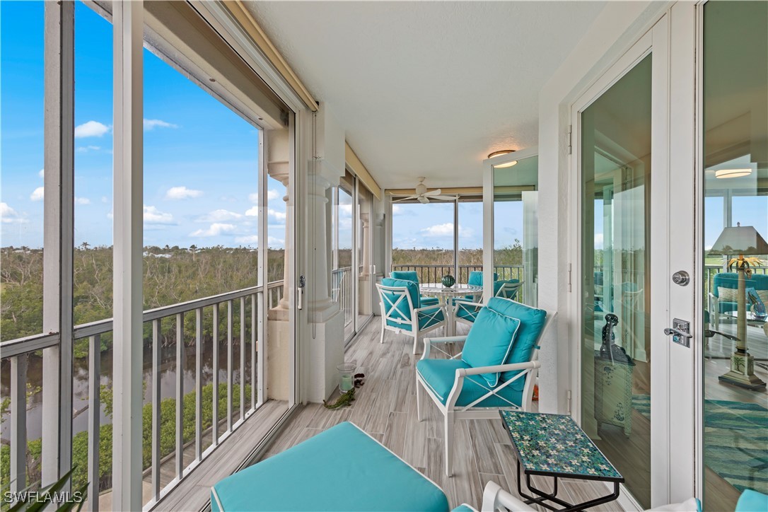 2605 Wulfert Road, Unit 5 Sanibel, FL 33957 - Photo 33 of 44 a balcony with chairs and with potted plants