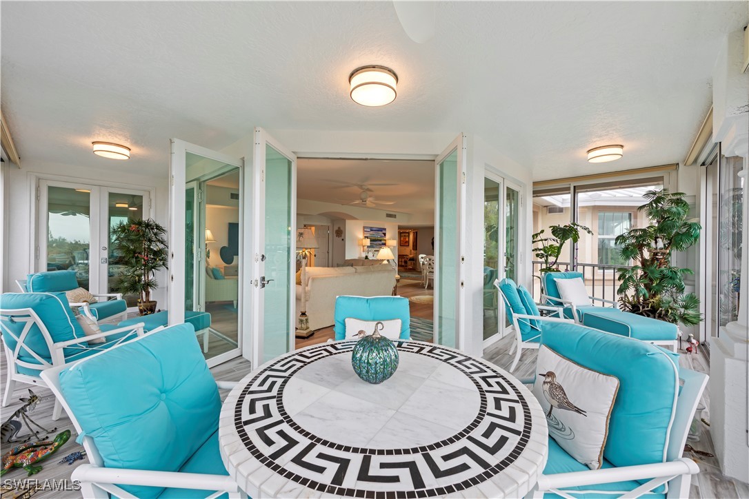 2605 Wulfert Road, Unit 5 Sanibel, FL 33957 - Photo 34 of 44 a living room with furniture and a table