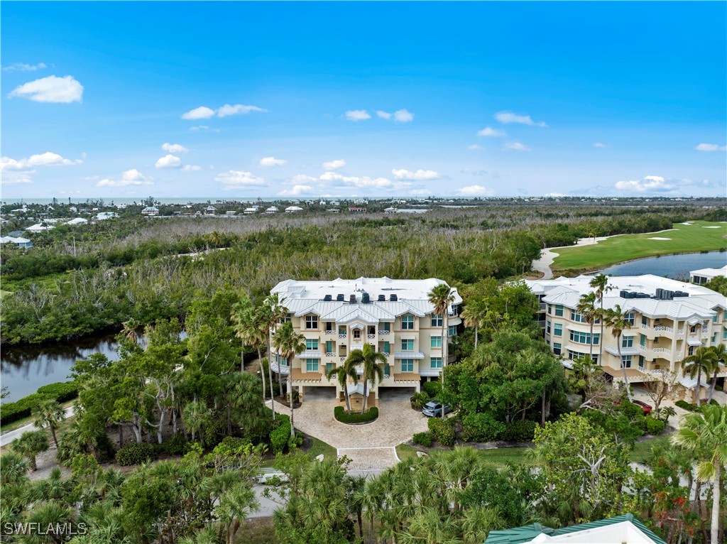 2605 Wulfert Road, Unit 5 Sanibel, FL 33957 - Photo 6 of 44 a view of a lake with a city
