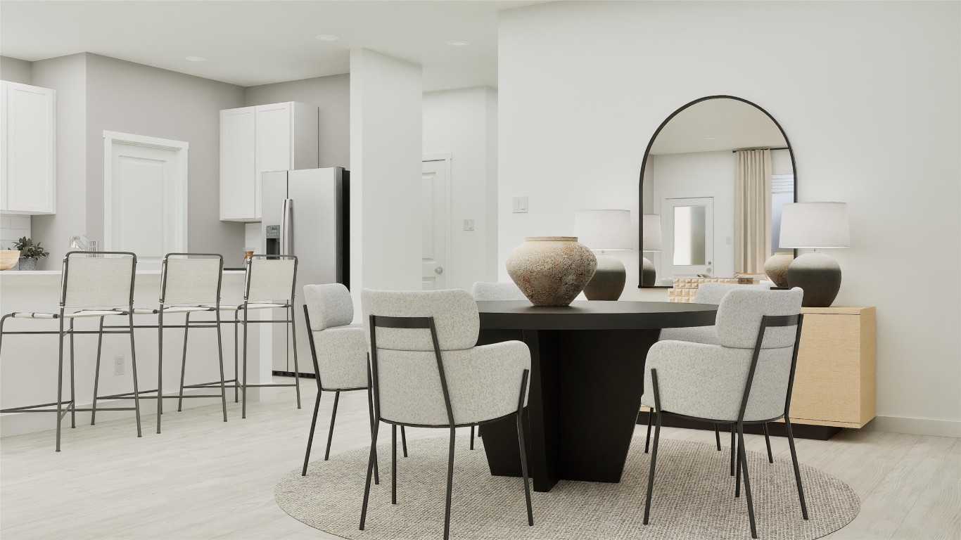 13312 Winton Drive Elgin, TX 78621 - Photo 23 of 35 a view of a dining room with furniture and wooden floor