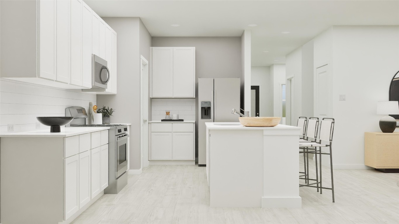 13312 Winton Drive Elgin, TX 78621 - Photo 27 of 35 a kitchen with cabinets and white appliances