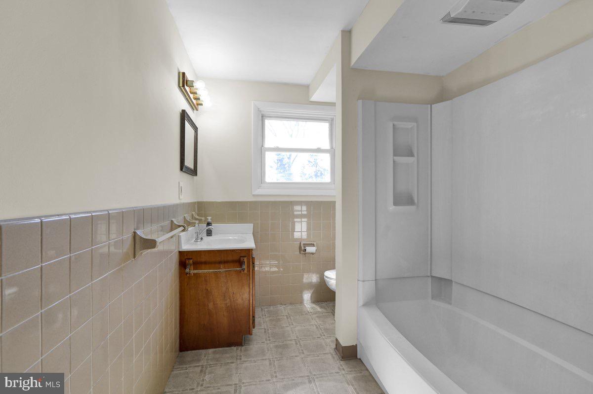 2326 Fairview Street Reading, PA 19609 - Photo 11 of 27 a bathroom with a bathtub sink and mirror
