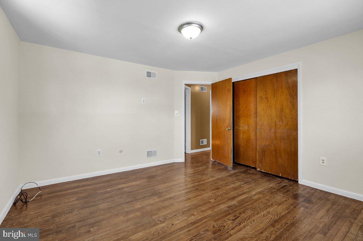 2326 Fairview Street Reading, PA 19609 - Photo 13 of 27 an empty room with wooden floor and closet area