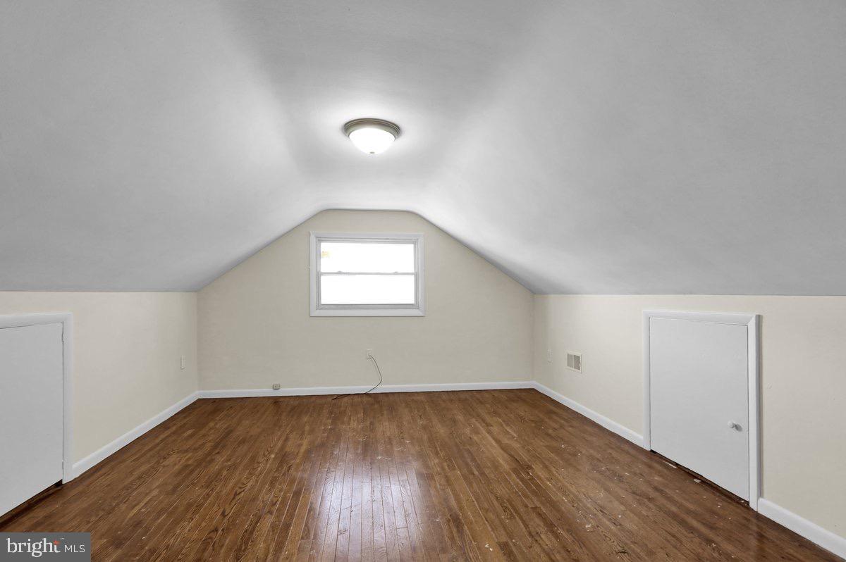 2326 Fairview Street Reading, PA 19609 - Photo 15 of 27 an empty room with wooden floor and windows